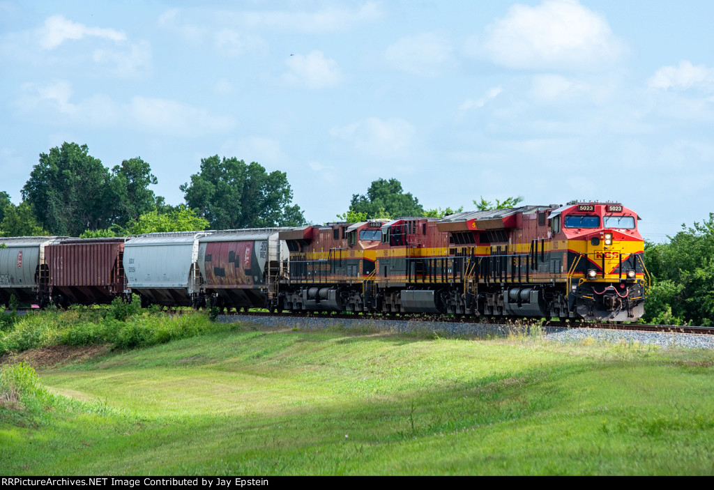 Empty grain rounds the bend at Wharton